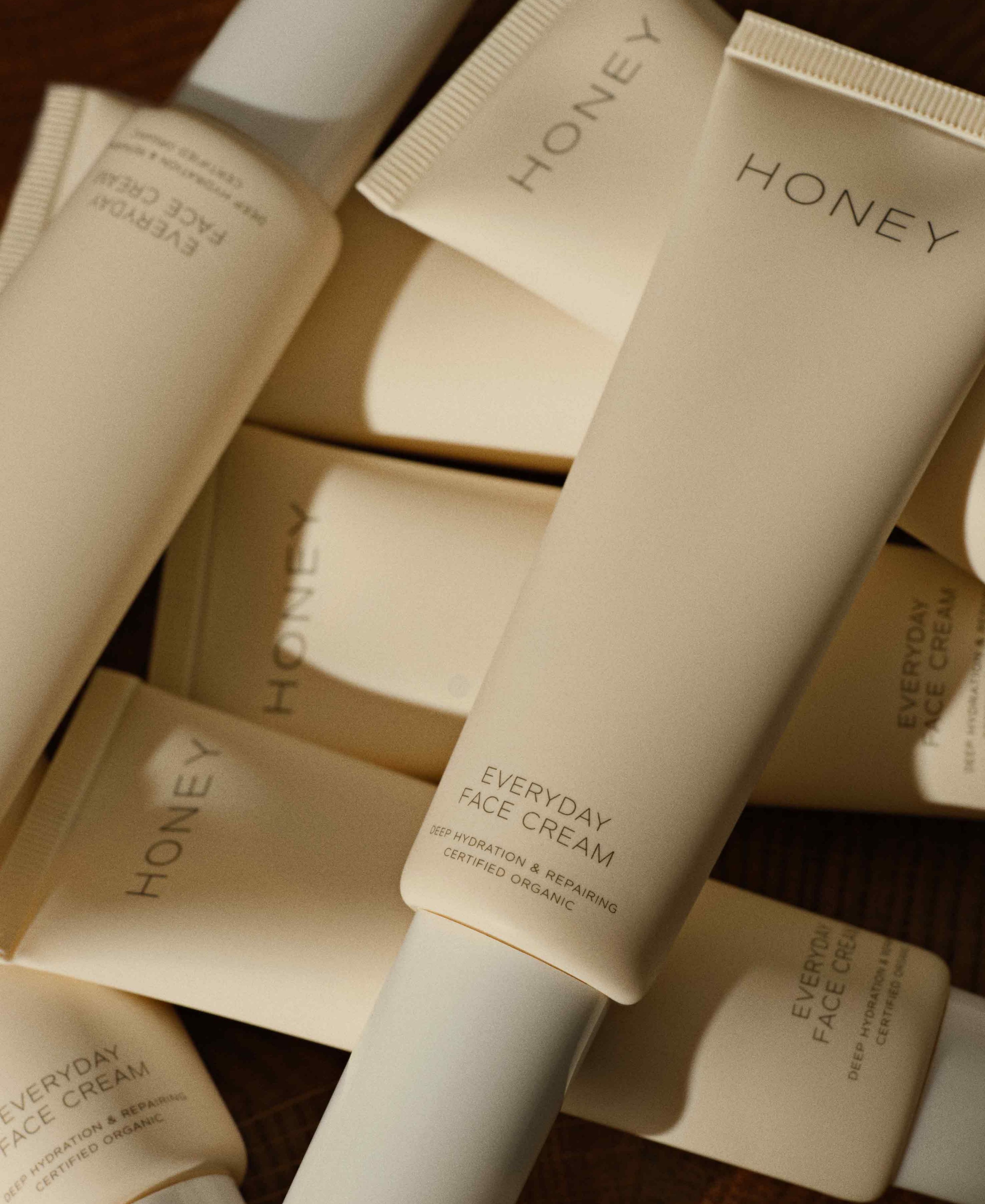 Heap with fragrance-free everyday face cream in light pink tube with white cap