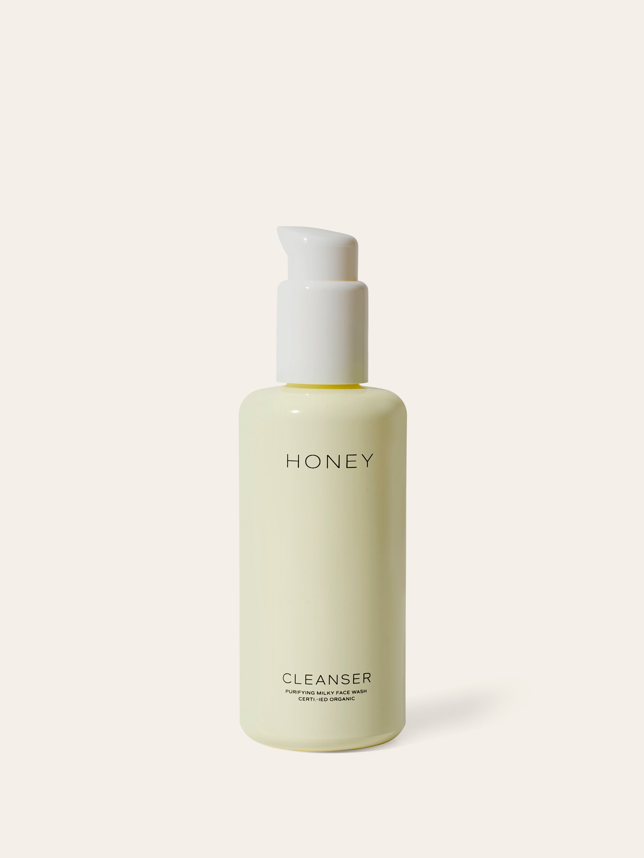 Natural clean skincare cleanser - face wash in light yellow bottle with white cap