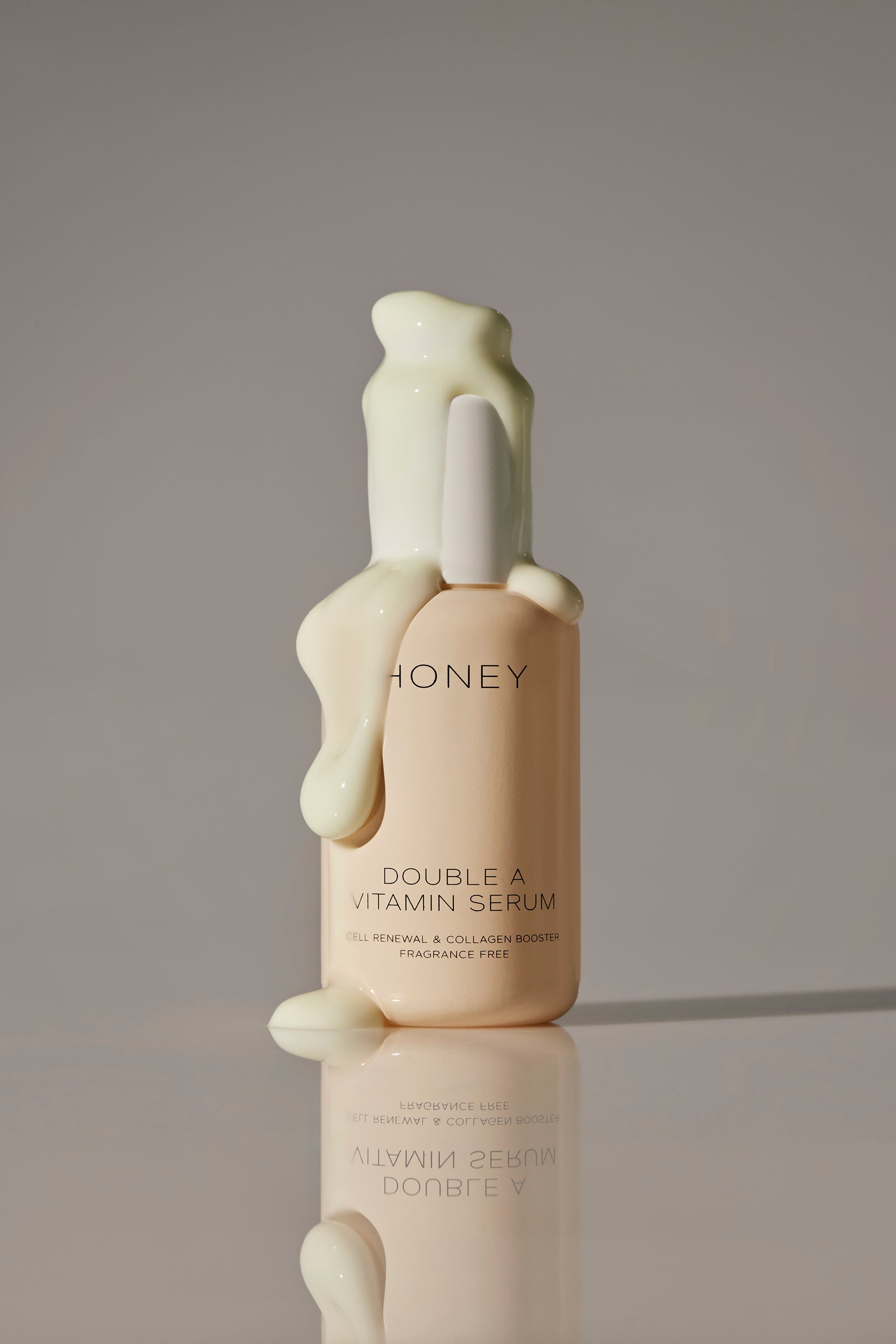 Natural and fragrance-free double A vitamin serum in light pink bottle with white cap