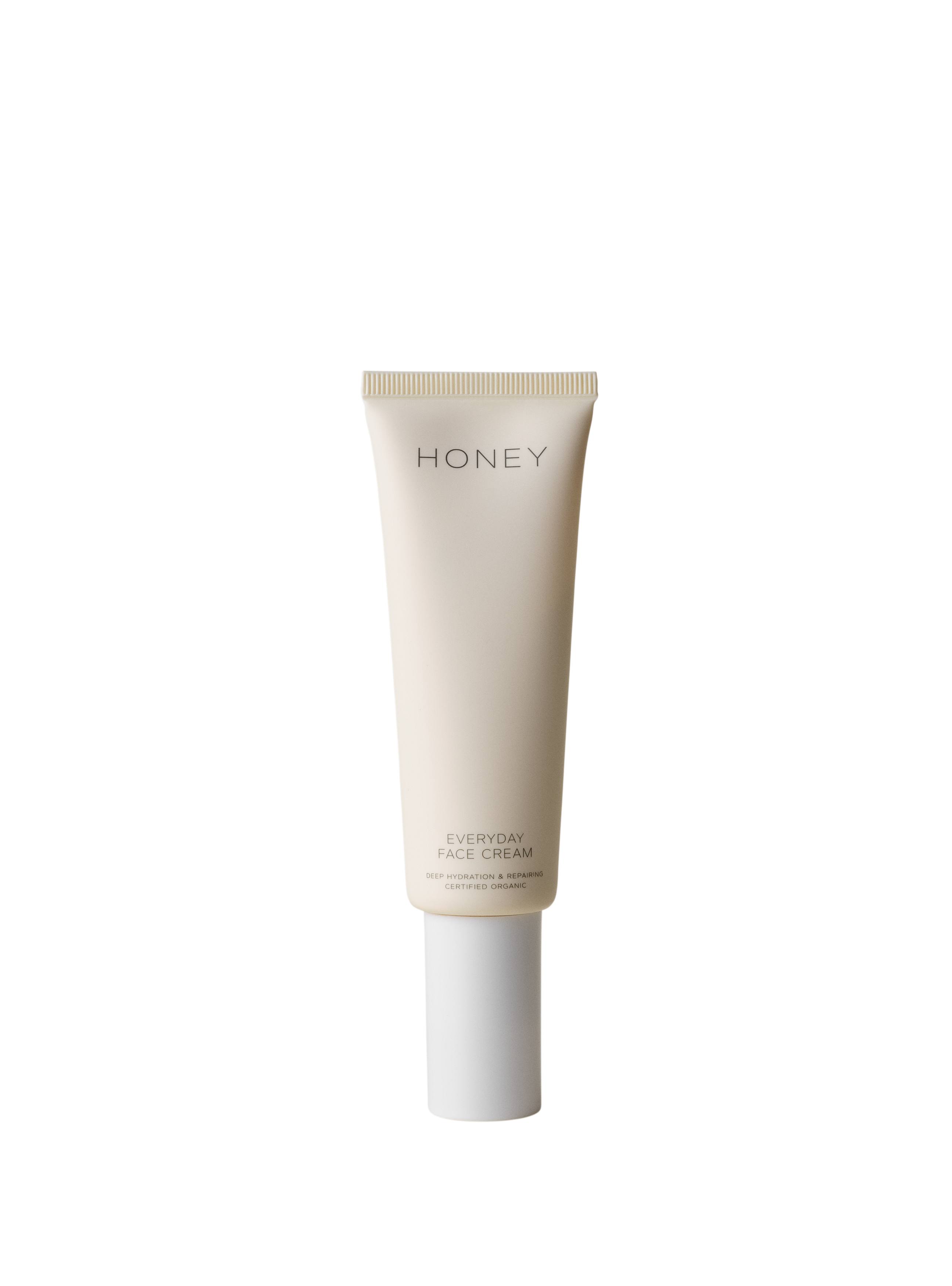 Natural fragrance-free day face cream in light pink tube with white cap - clean skincare