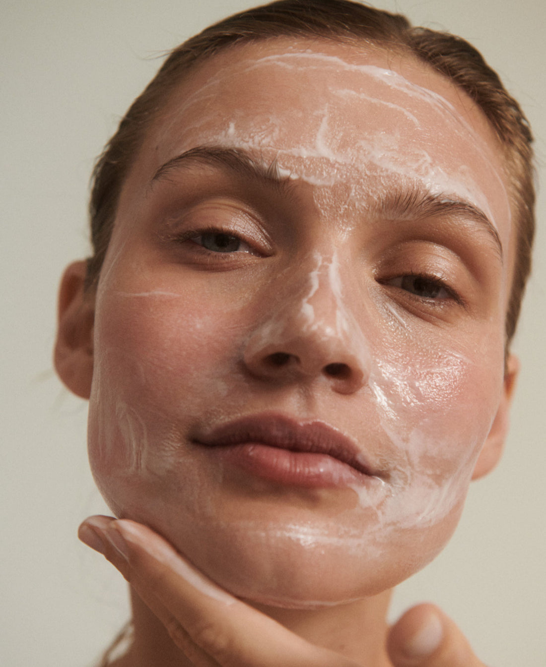 Woman with natural and fragrance-free cleanser on her face